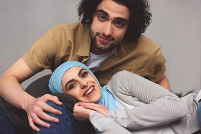 a young arab couple cuddling and posing together