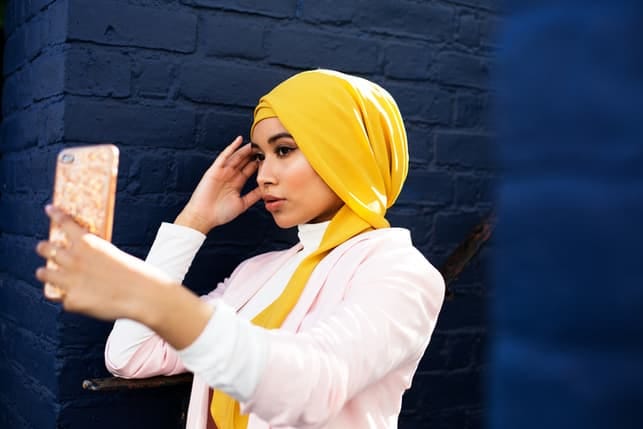 a beautiful Muslim girl taking a selfie