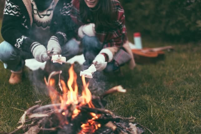 a beautiful couple on a cosy autumn picnic outdoors