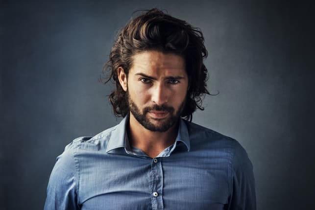 beautiful Italian man in a blue shirt