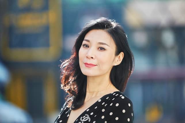 a mature asian woman outdoors